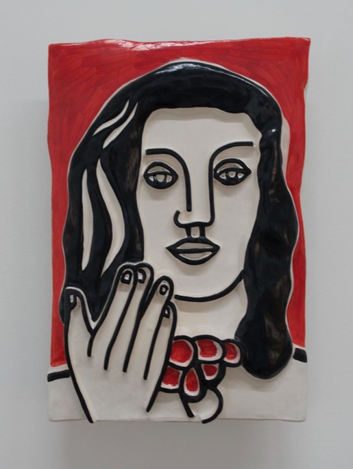 Face By Hand On A Red Background
